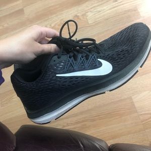 Women’s black Nike running shoes. Size 8